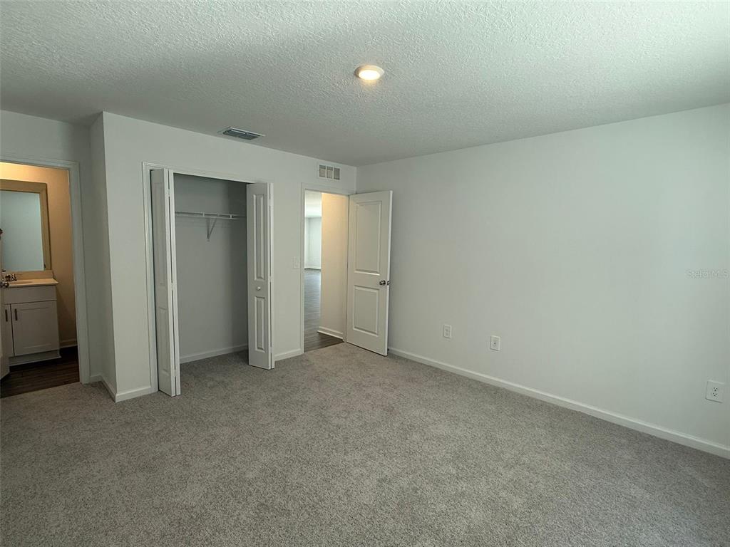 8283 Southwest 42nd Circle Ocala, FL 34476 - Photo 12 of 16 an empty room with closet and bathroom