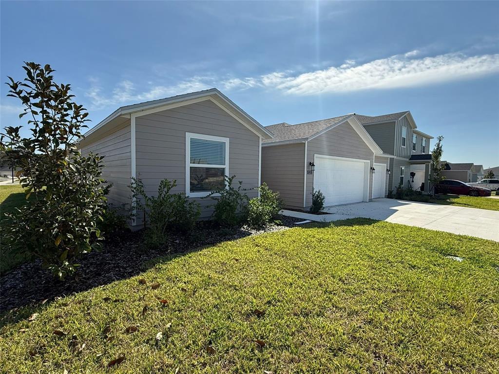 8283 Southwest 42nd Circle Ocala, FL 34476 - Photo 2 of 16 a house view with a garden space