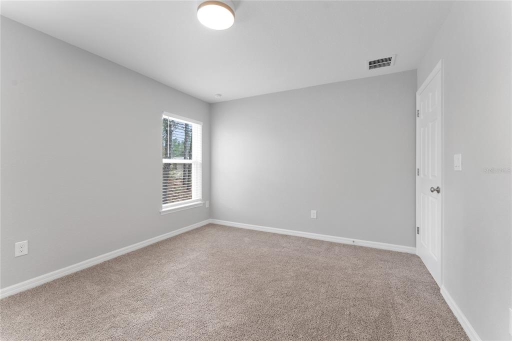9461 North Sandree Drive Citrus Springs, FL 34434 - Photo 29 of 50 a view of an empty room with a window