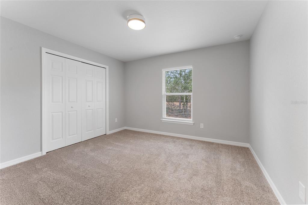 9461 North Sandree Drive Citrus Springs, FL 34434 - Photo 32 of 50 an empty room with windows