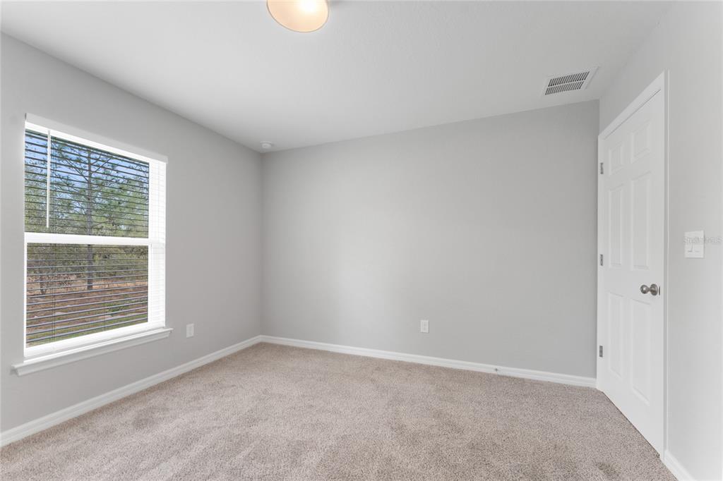 9461 North Sandree Drive Citrus Springs, FL 34434 - Photo 35 of 50 an empty room with a window