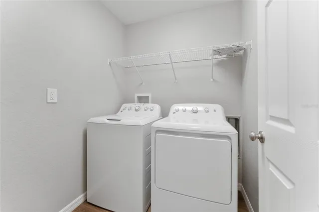 a utility room with dryer and washer