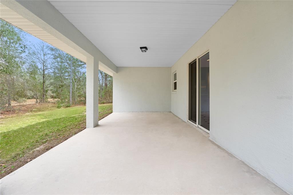9461 North Sandree Drive Citrus Springs, FL 34434 - Photo 38 of 50 a view of a porch with a backyard