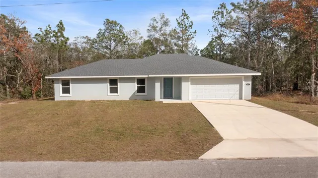 a house with trees in the background