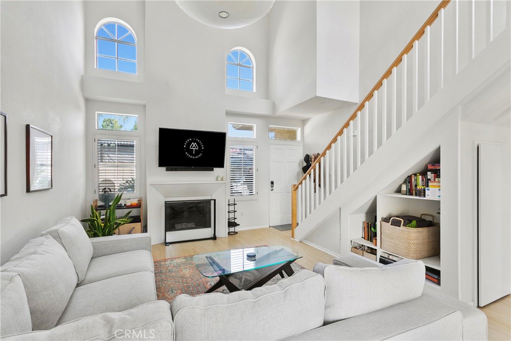 2575 Elden Avenue, Unit 2 Costa Mesa, CA 92627 - Photo 1 of 12 a living room with furniture and a fireplace