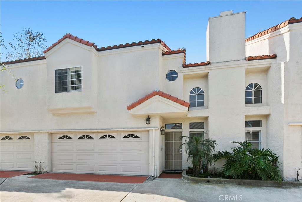 2575 Elden Avenue, Unit 2 Costa Mesa, CA 92627 - Photo 12 of 12 a front view of a house with a yard