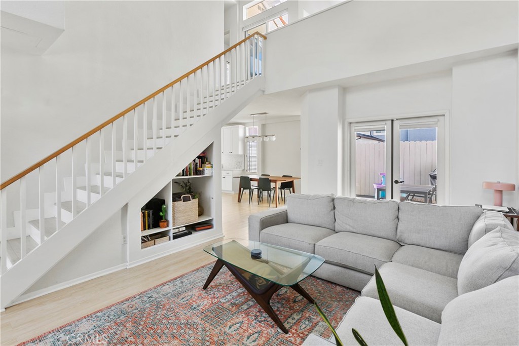 2575 Elden Avenue, Unit 2 Costa Mesa, CA 92627 - Photo 2 of 12 a living room with furniture and stairs