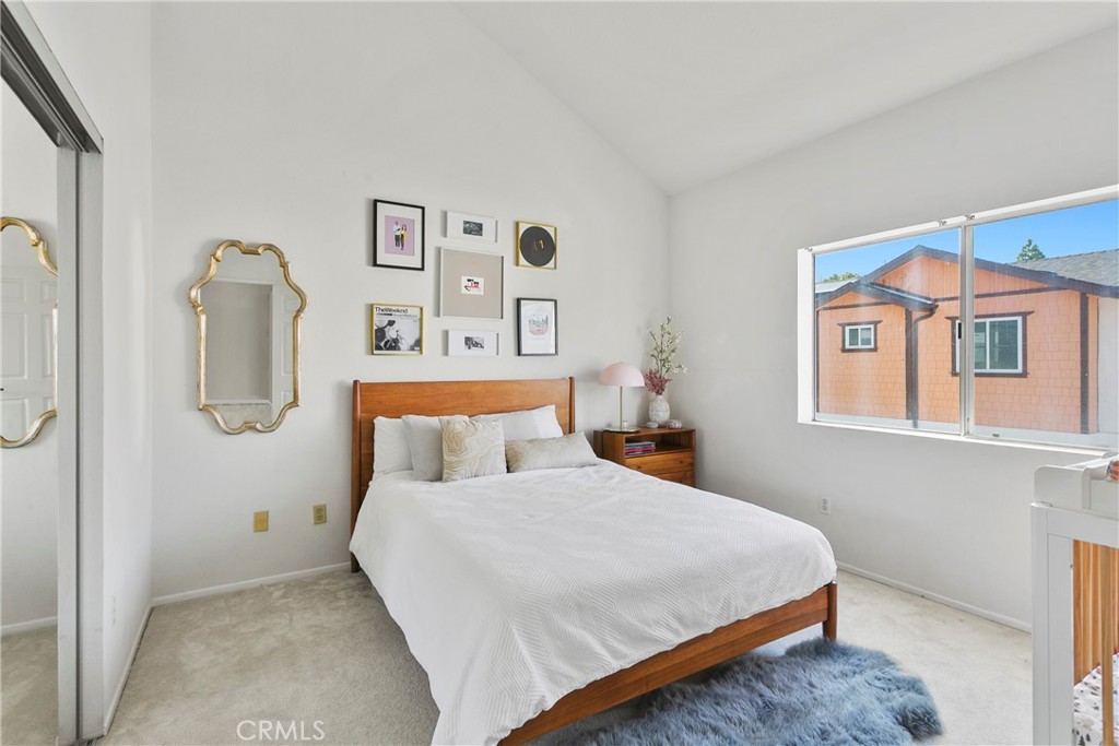 2575 Elden Avenue, Unit 2 Costa Mesa, CA 92627 - Photo 5 of 12 a bedroom with a bed and painting on the wall