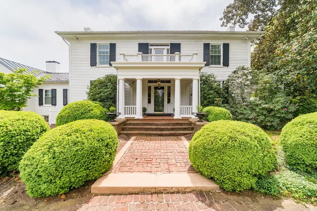 an aerial view of a house with a garden