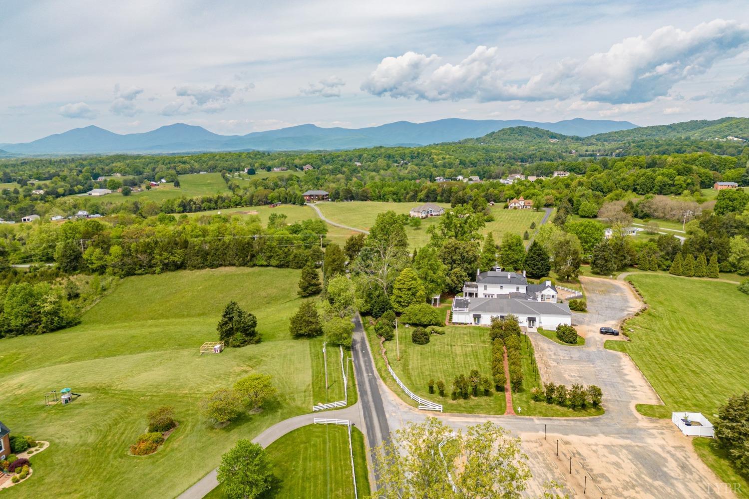 7821 Bellevue Road Goode, VA 24556 - Photo 17 of 78 a view of a lake with a mountain