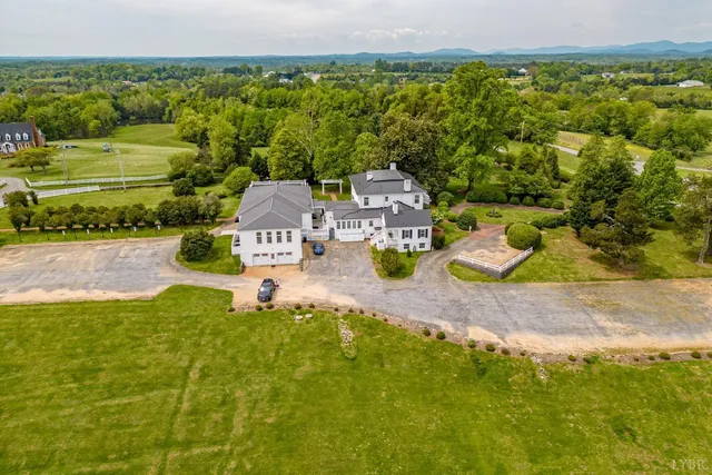 an aerial view of houses with outdoor space