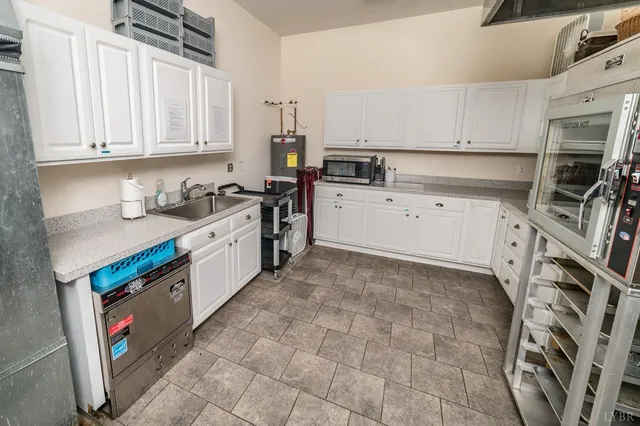 a living room with furniture a table and chairs