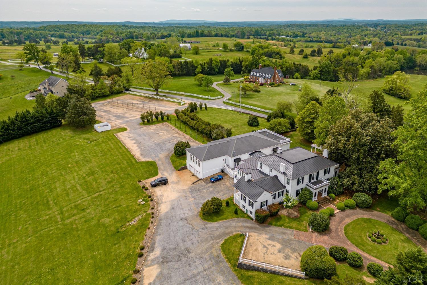 7821 Bellevue Road Goode, VA 24556 - Photo 6 of 78 an aerial view of a house with a garden