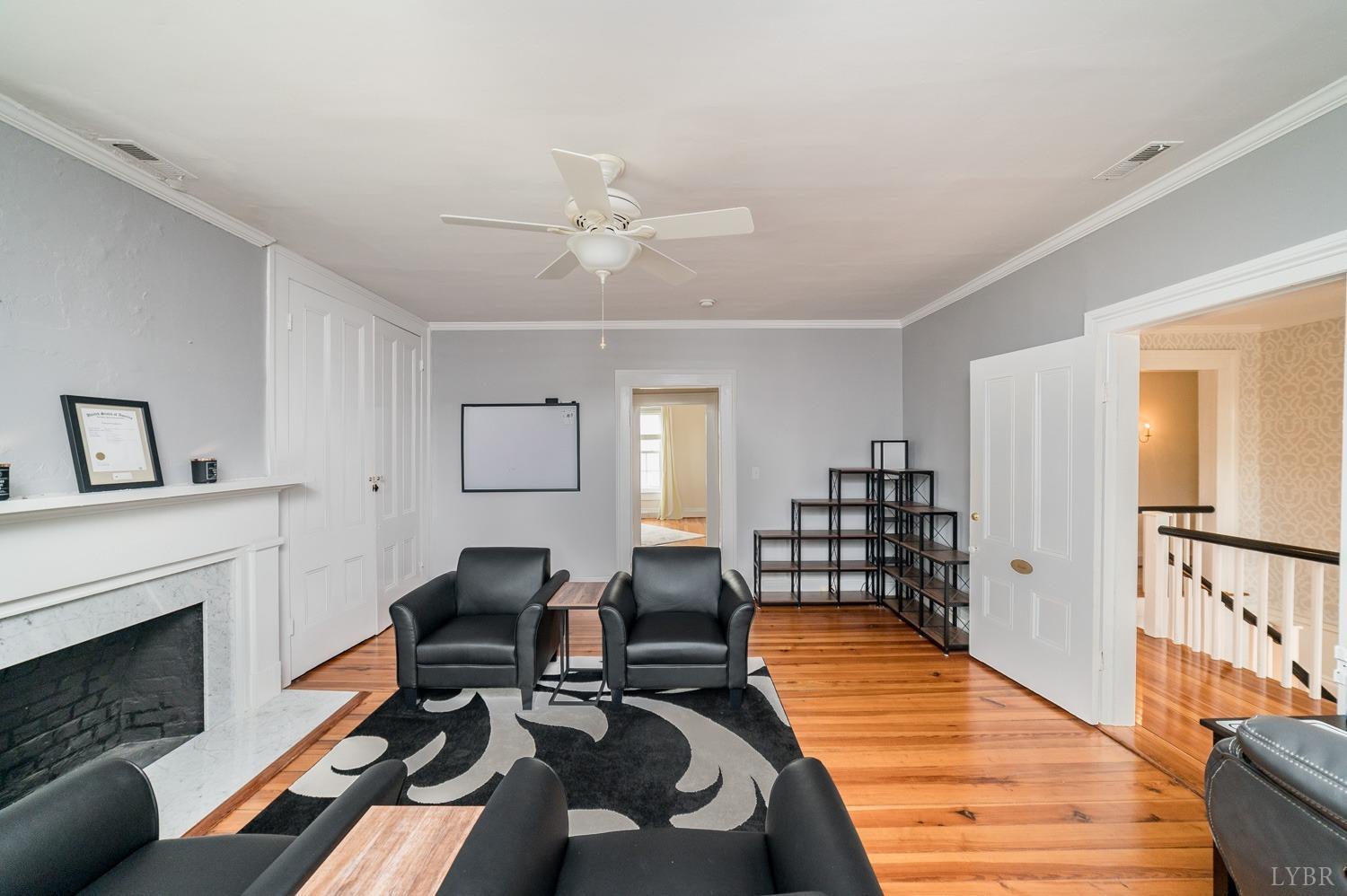 7821 Bellevue Road Goode, VA 24556 - Photo 65 of 78 a living room with furniture and a fireplace