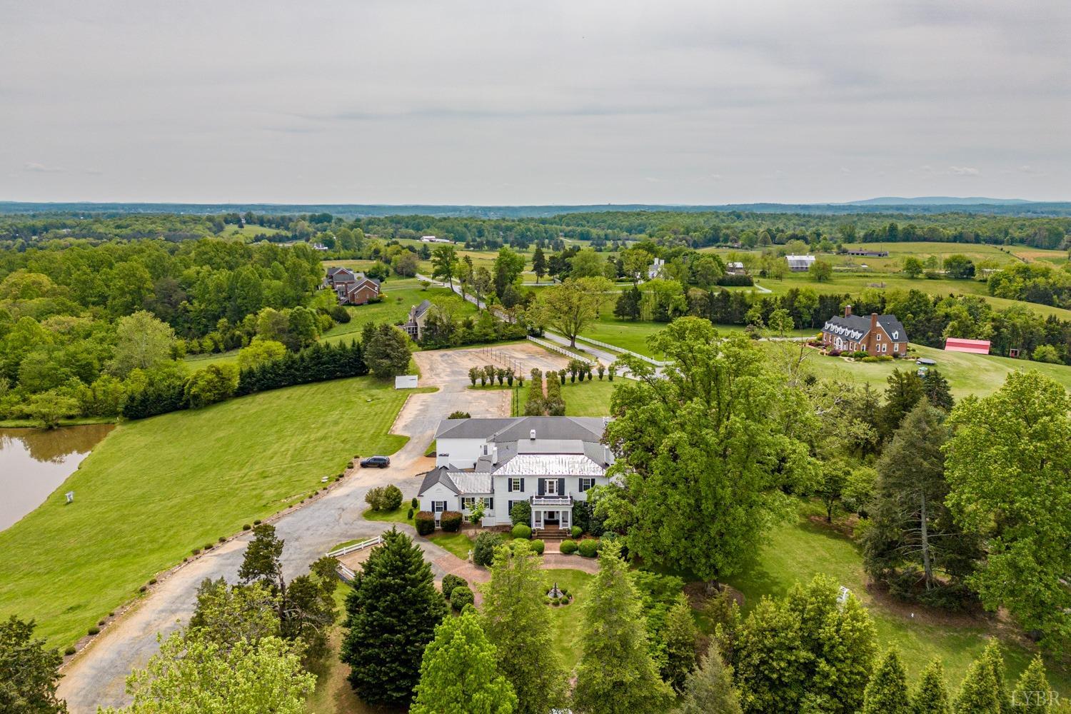 7821 Bellevue Road Goode, VA 24556 - Photo 7 of 78 an aerial view of residential houses with outdoor space and trees