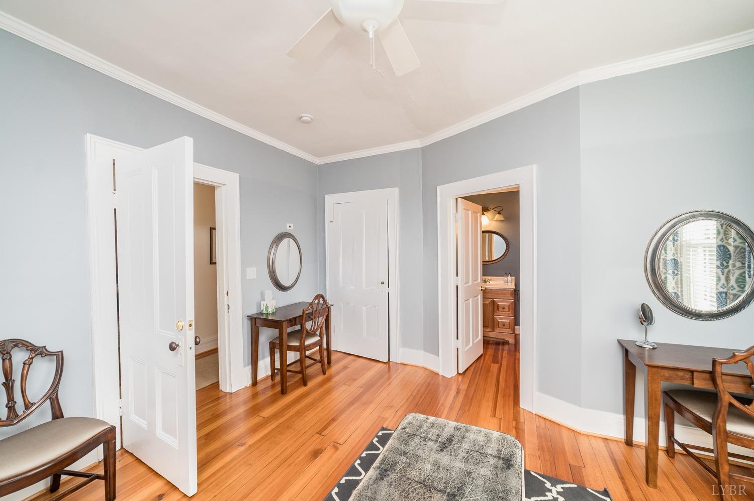 7821 Bellevue Road Goode, VA 24556 - Photo 71 of 78 a living room with furniture a mirror and wooden floor
