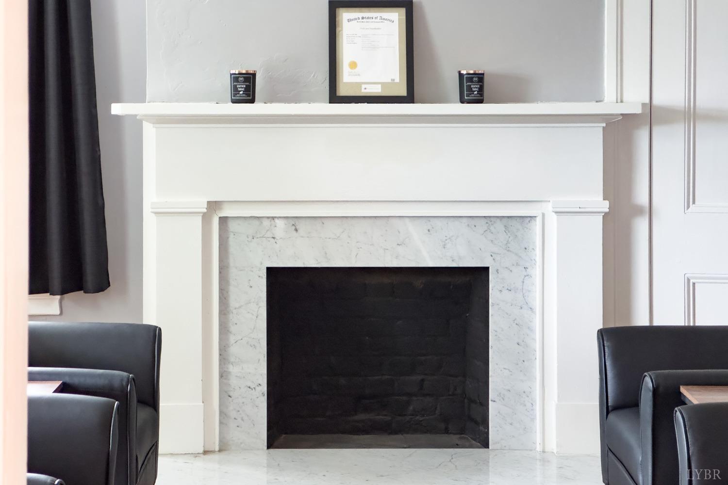7821 Bellevue Road Goode, VA 24556 - Photo 77 of 78 a living room with a fireplace and a flat screen tv