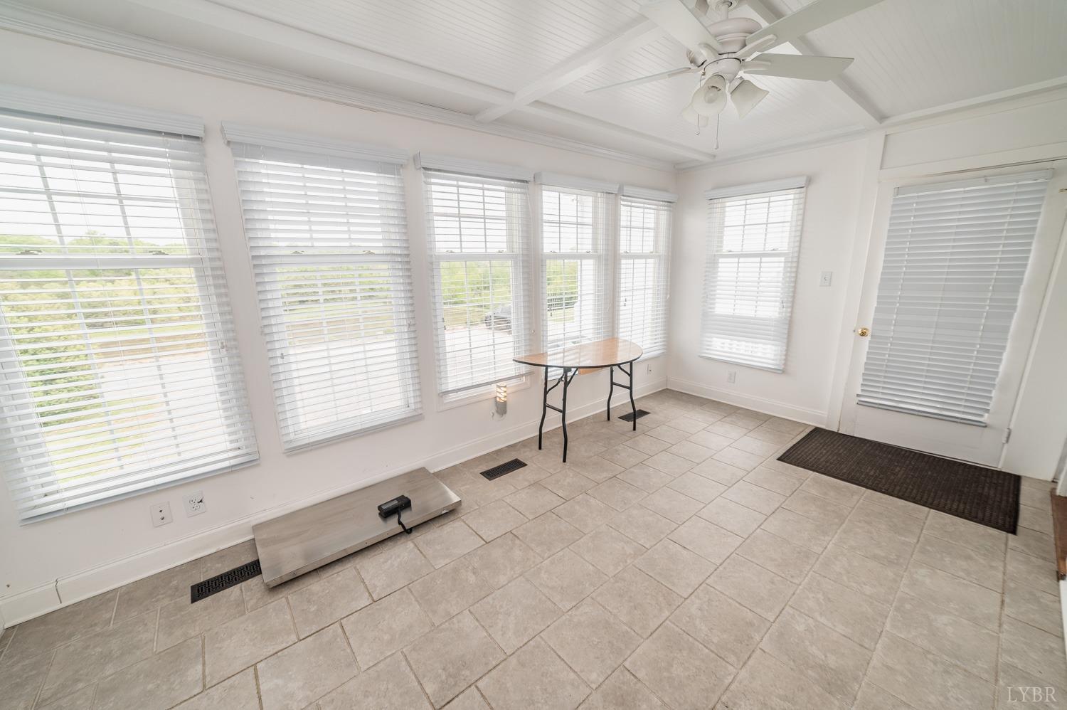 7821 Bellevue Road Goode, VA 24556 - Photo 78 of 78 a spacious bedroom with a bed and a window