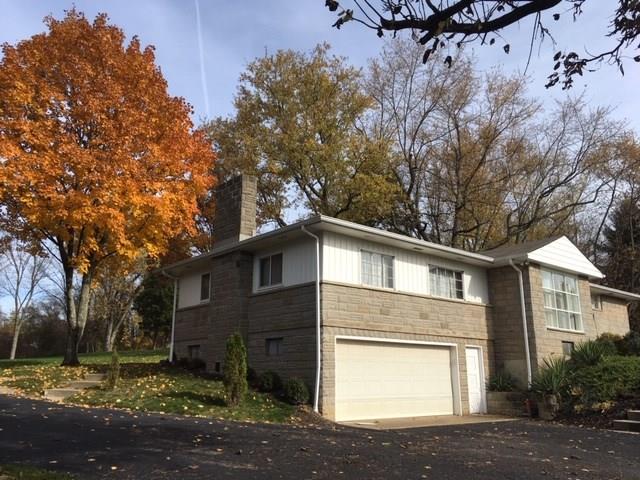 135 Economy Grade Road Coraopolis, PA 15108 - Photo 2 of 21 LARGER THAN IT LOOKS with a Two Car oversized garage and mandoor for easy access.