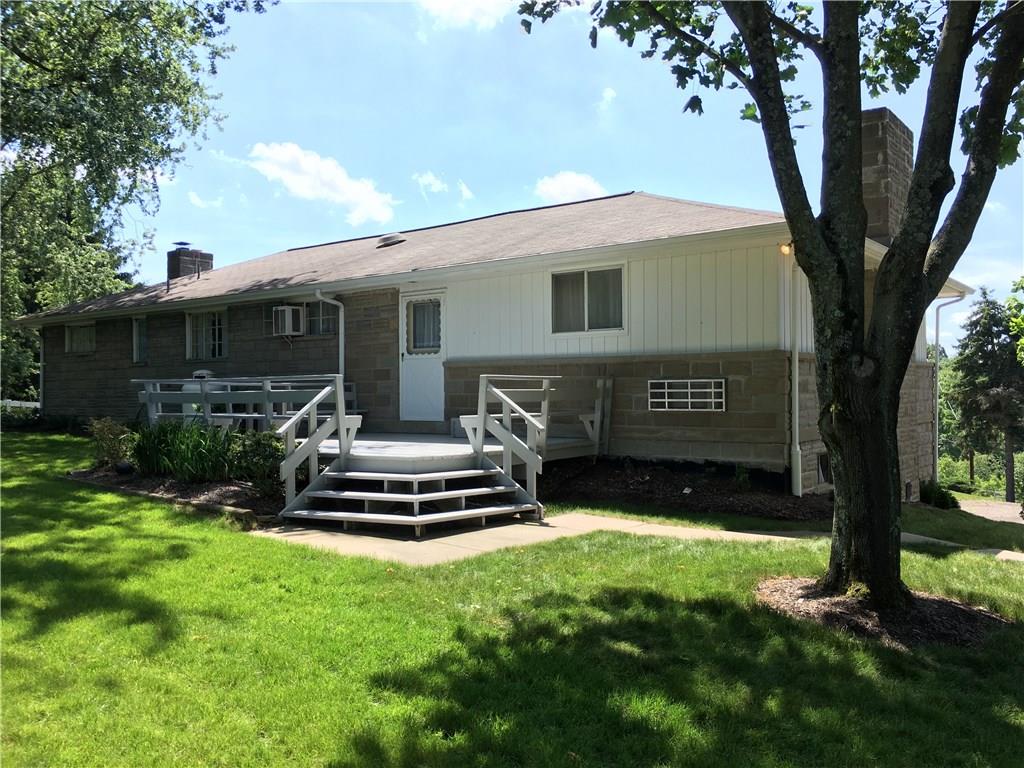 135 Economy Grade Road Coraopolis, PA 15108 - Photo 4 of 21 NICE Rear deck with built in seating - large custom built table & decorative planter included in the sale.