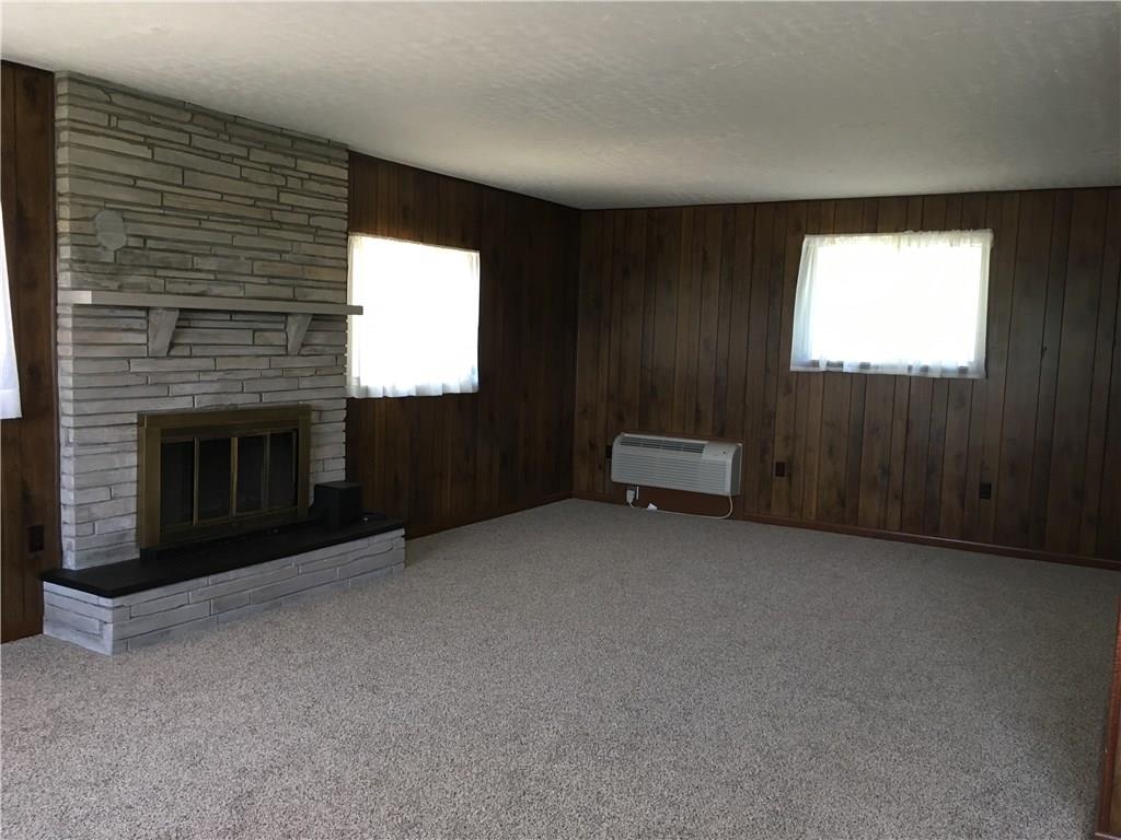 135 Economy Grade Road Coraopolis, PA 15108 - Photo 7 of 21 Huge Family Room 25x24. NEW Carpet, Stone - wood burning fireplace. NEW Wall Airconditioning/Heat unit. Two Cedar closets and access to rear deck.