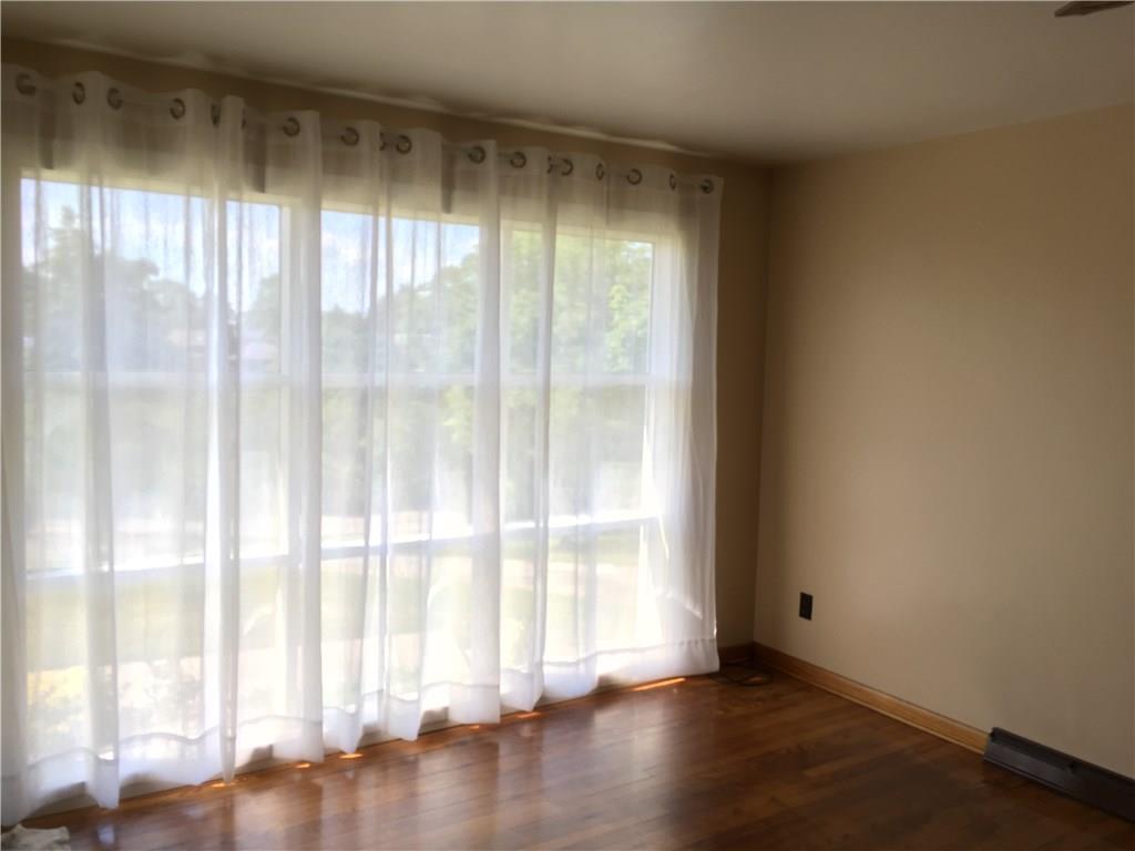 135 Economy Grade Road Coraopolis, PA 15108 - Photo 10 of 21 Large picture window in Living Room. B e A u T i F U L HARDWOOD FLOORS in Living Room, Dining Room, Hall Way and all three bedrooms.