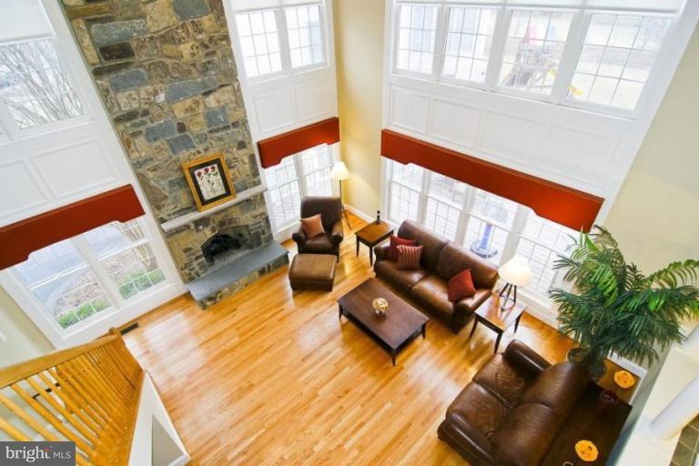 18506 Thundercloud Road Boyds, MD 20841 - Photo 6 of 17 a living room with furniture and a floor to ceiling window