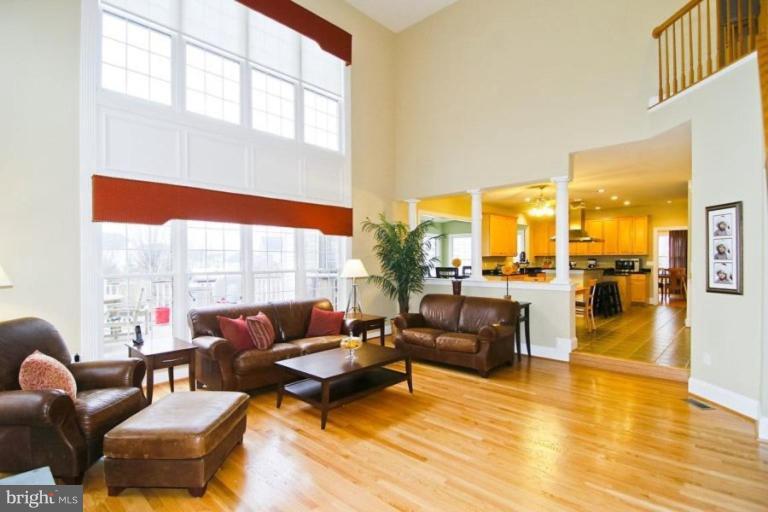 18506 Thundercloud Road Boyds, MD 20841 - Photo 10 of 17 a living room with furniture and floor to ceiling windows