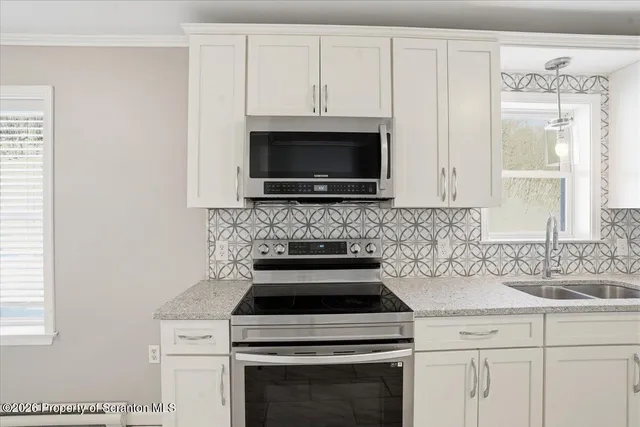 a view of a chandelier fan in a room