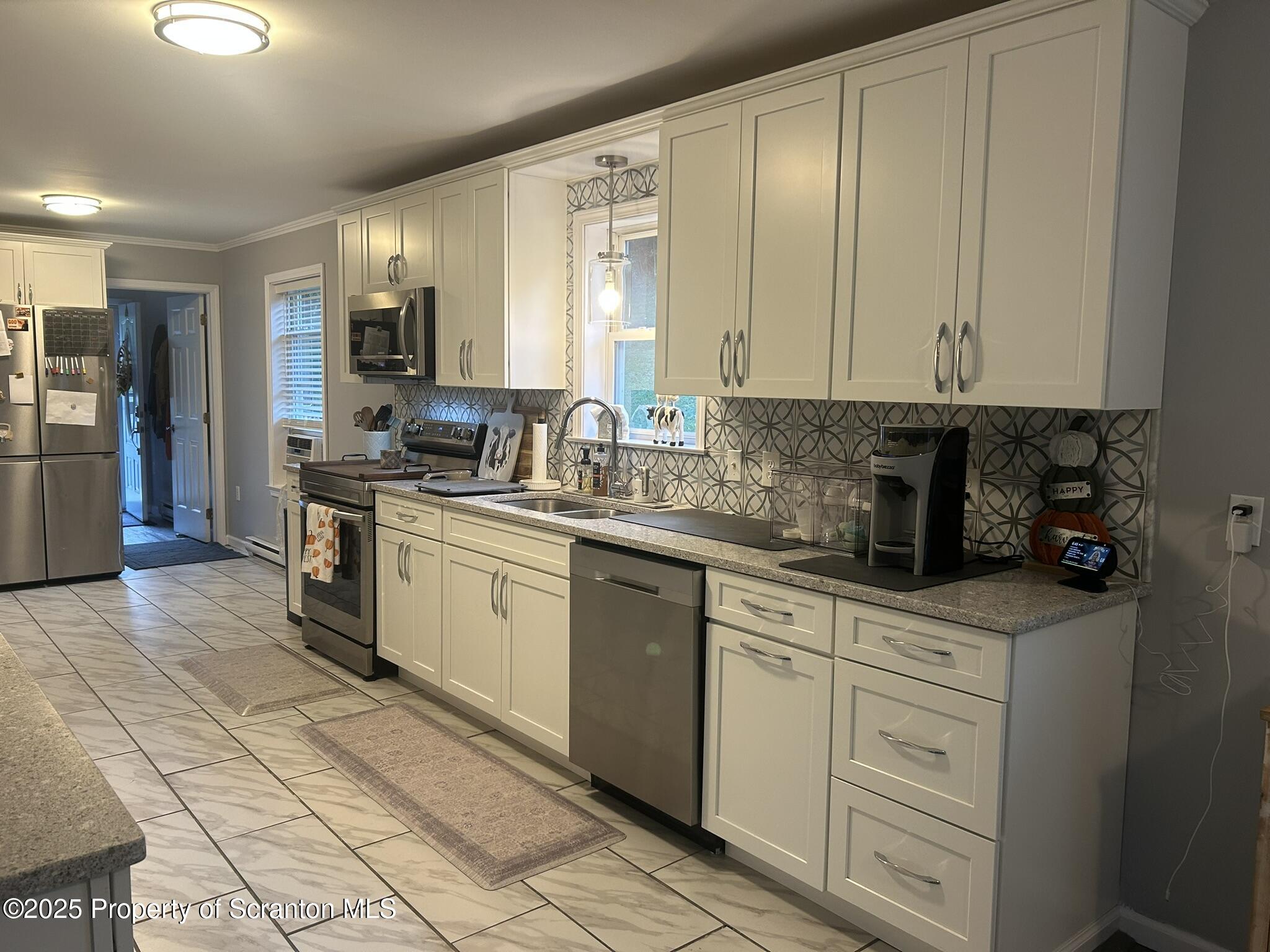 44 Franks Old Road Pleasant Mount, PA 18453 - Photo 15 of 37 a kitchen with a white cabinets and white appliances