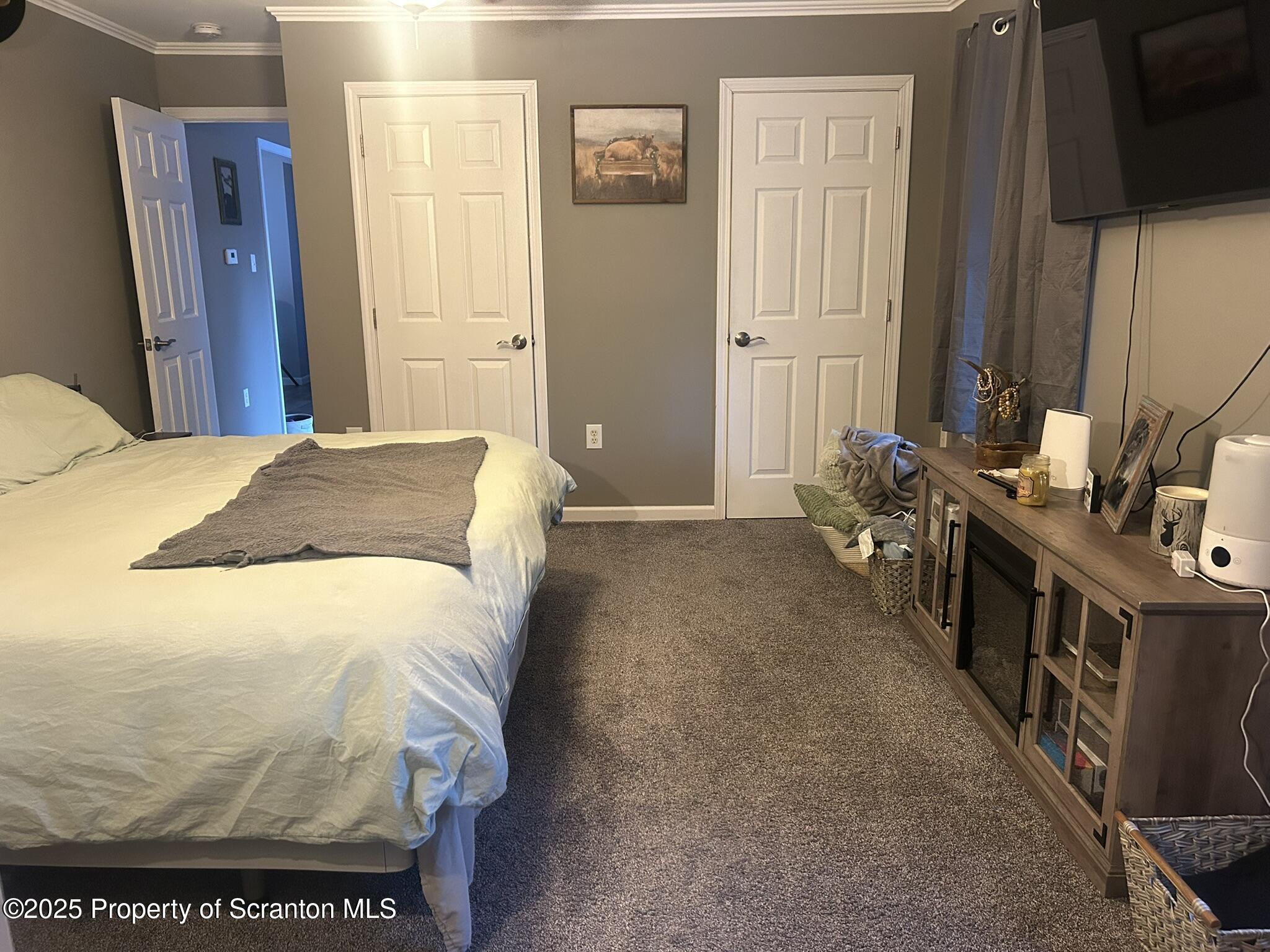 44 Franks Old Road Pleasant Mount, PA 18453 - Photo 20 of 37 a bedroom with a bed and a flat tv screen