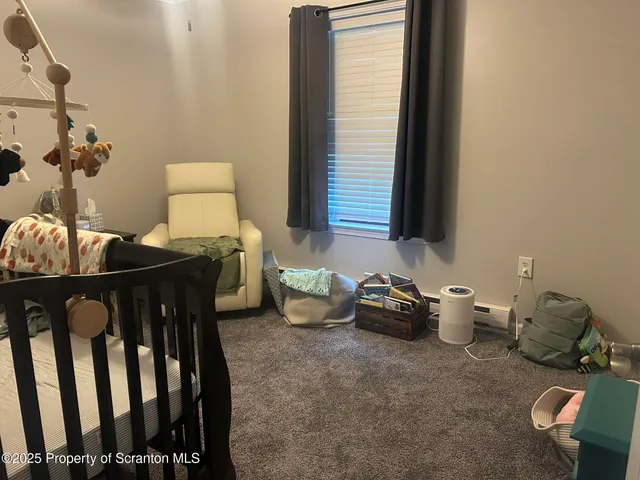 a view of entryway and kitchen