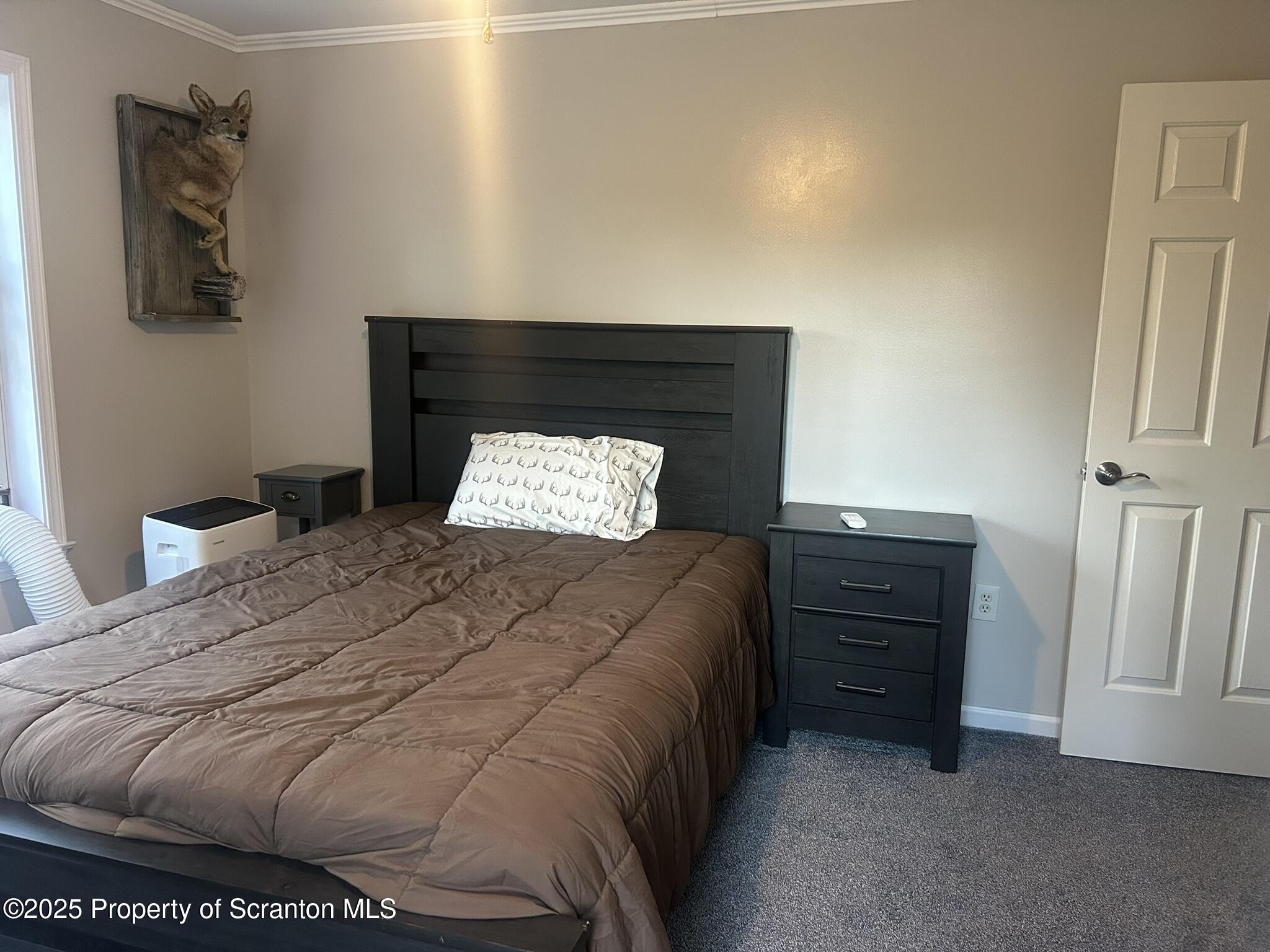 44 Franks Old Road Pleasant Mount, PA 18453 - Photo 27 of 37 a bedroom with a bed and window