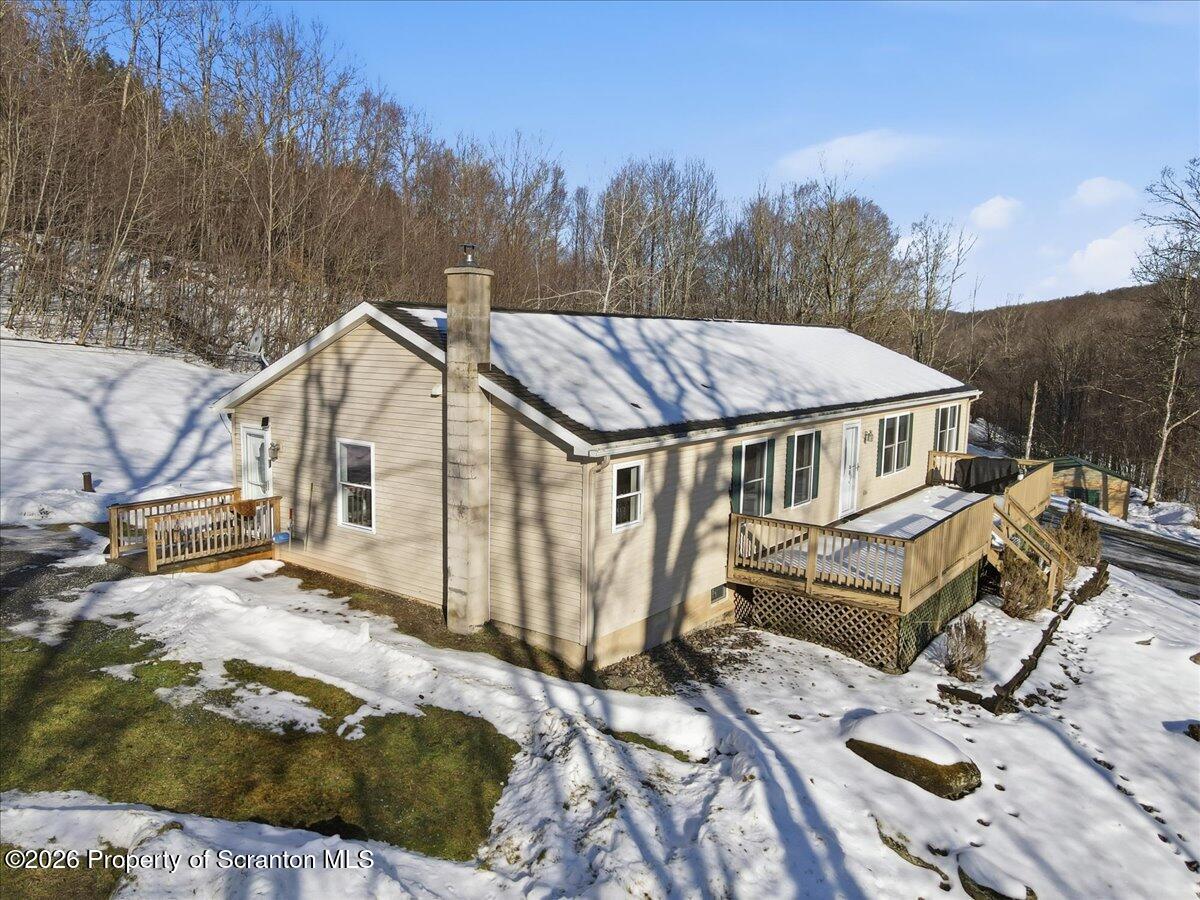 44 Franks Old Road Pleasant Mount, PA 18453 - Photo 3 of 49 a view of a house with backyard space and wooden deck