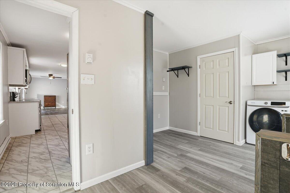 44 Franks Old Road Pleasant Mount, PA 18453 - Photo 31 of 49 a view of a hallway and closet with wooden floor