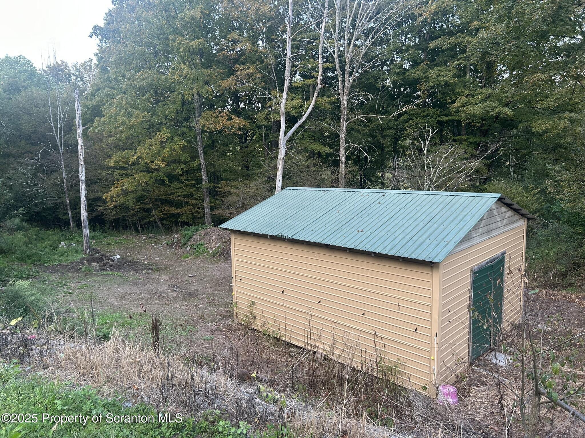 44 Franks Old Road Pleasant Mount, PA 18453 - Photo 33 of 37 a backyard of a house with lots of green space