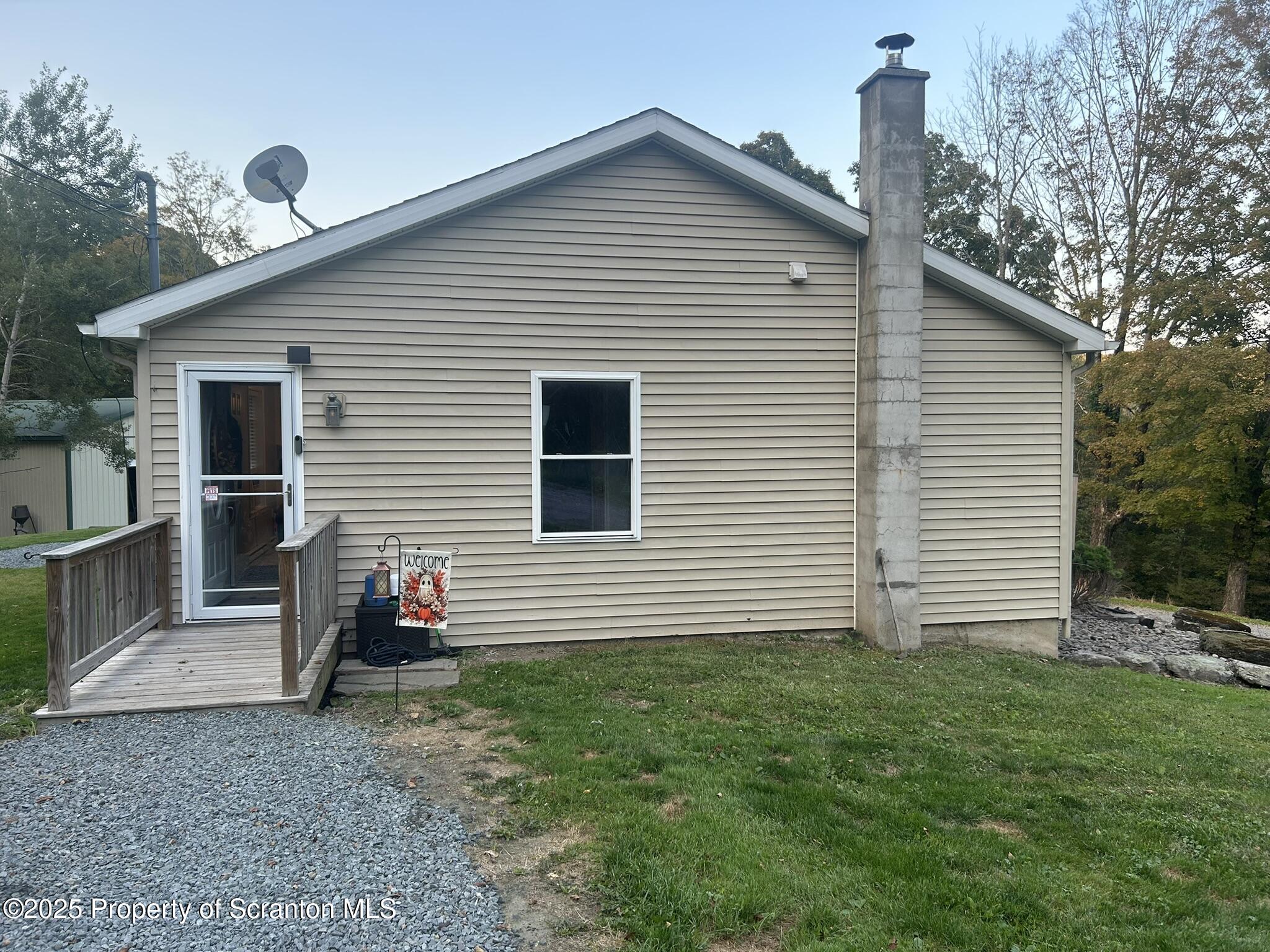 44 Franks Old Road Pleasant Mount, PA 18453 - Photo 4 of 37 a view of a house with backyard