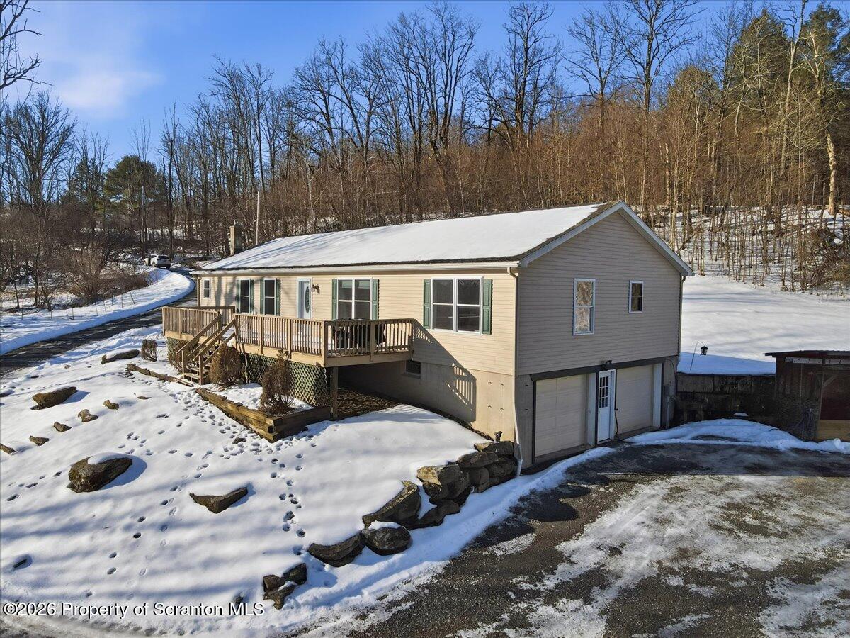 44 Franks Old Road Pleasant Mount, PA 18453 - Photo 4 of 49 a view of a house with snow on the side of the road