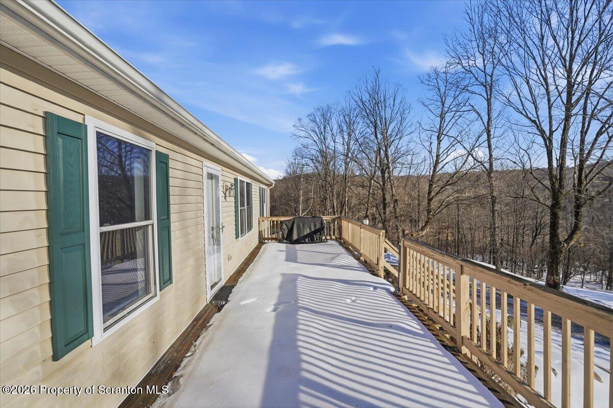 44 Franks Old Road Pleasant Mount, PA 18453 - Photo 7 of 49 a view of balcony with wooden floor and fence and floor