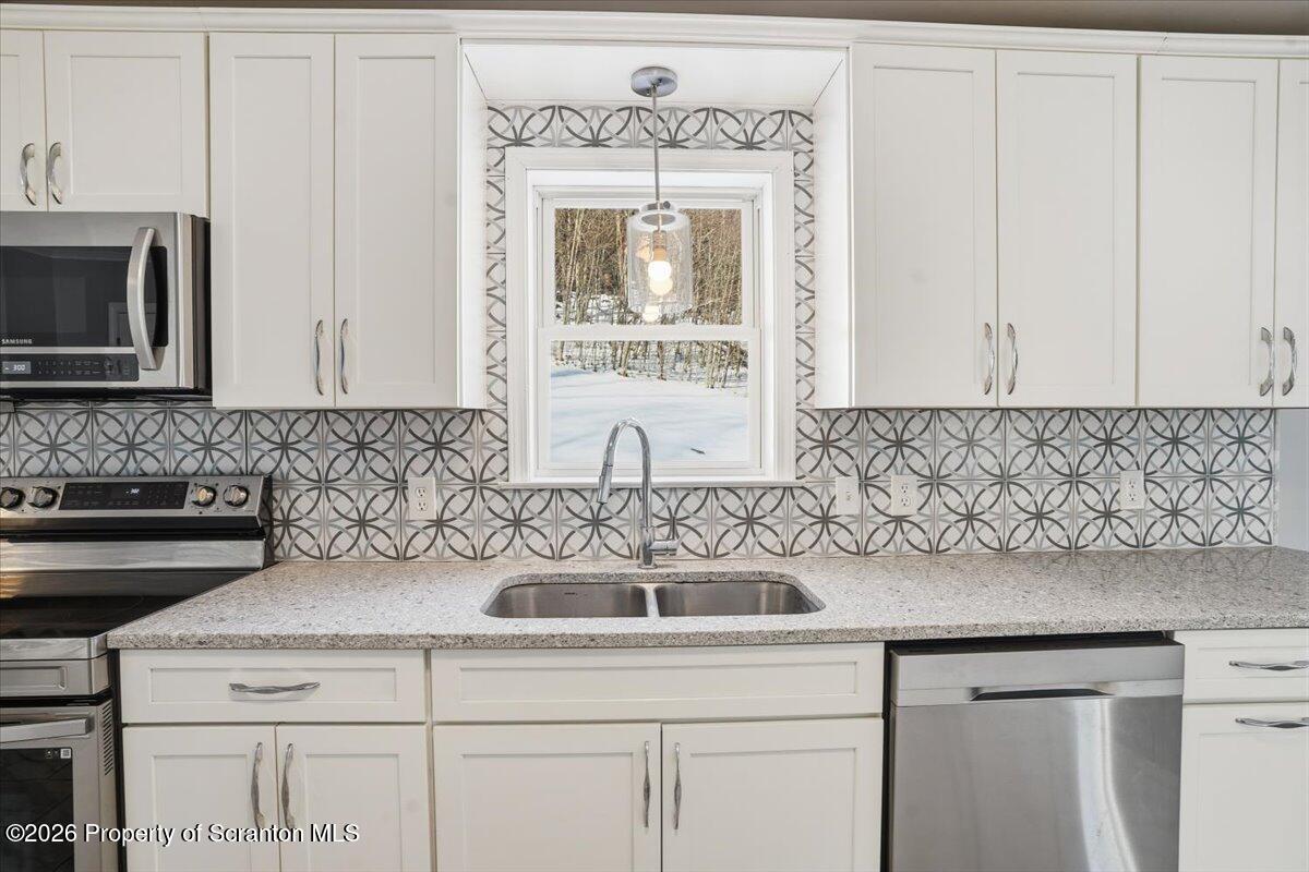 44 Franks Old Road Pleasant Mount, PA 18453 - Photo 10 of 49 a kitchen with a sink and cabinets