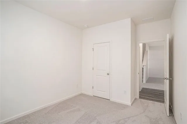 an empty room with a hallway