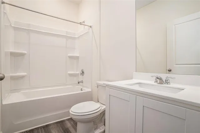 a bathroom with a sink a toilet and a bathtub