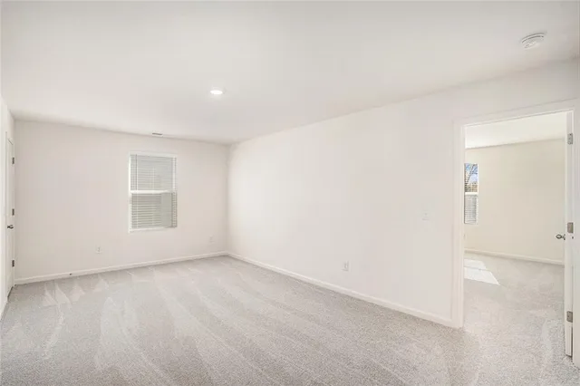 an empty room with a empty space and window