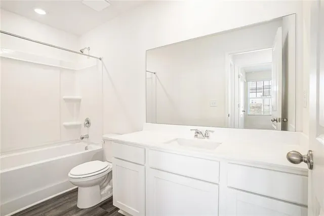 a bathroom with a sink a toilet and a bathtub