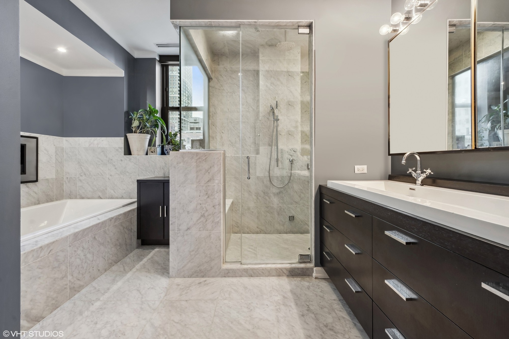 6 North Michigan Avenue, Unit 1901 Chicago, IL 60602 - Photo 38 of 54 a bathroom with a tub sink shower and mirror