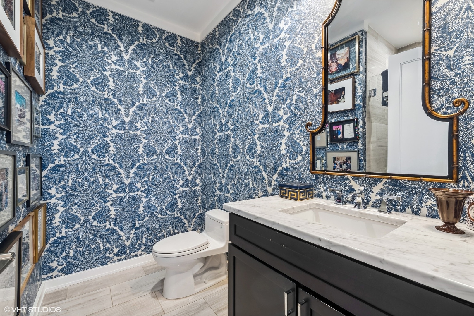 6 North Michigan Avenue, Unit 1901 Chicago, IL 60602 - Photo 41 of 54 a bathroom with a granite countertop toilet sink and mirror