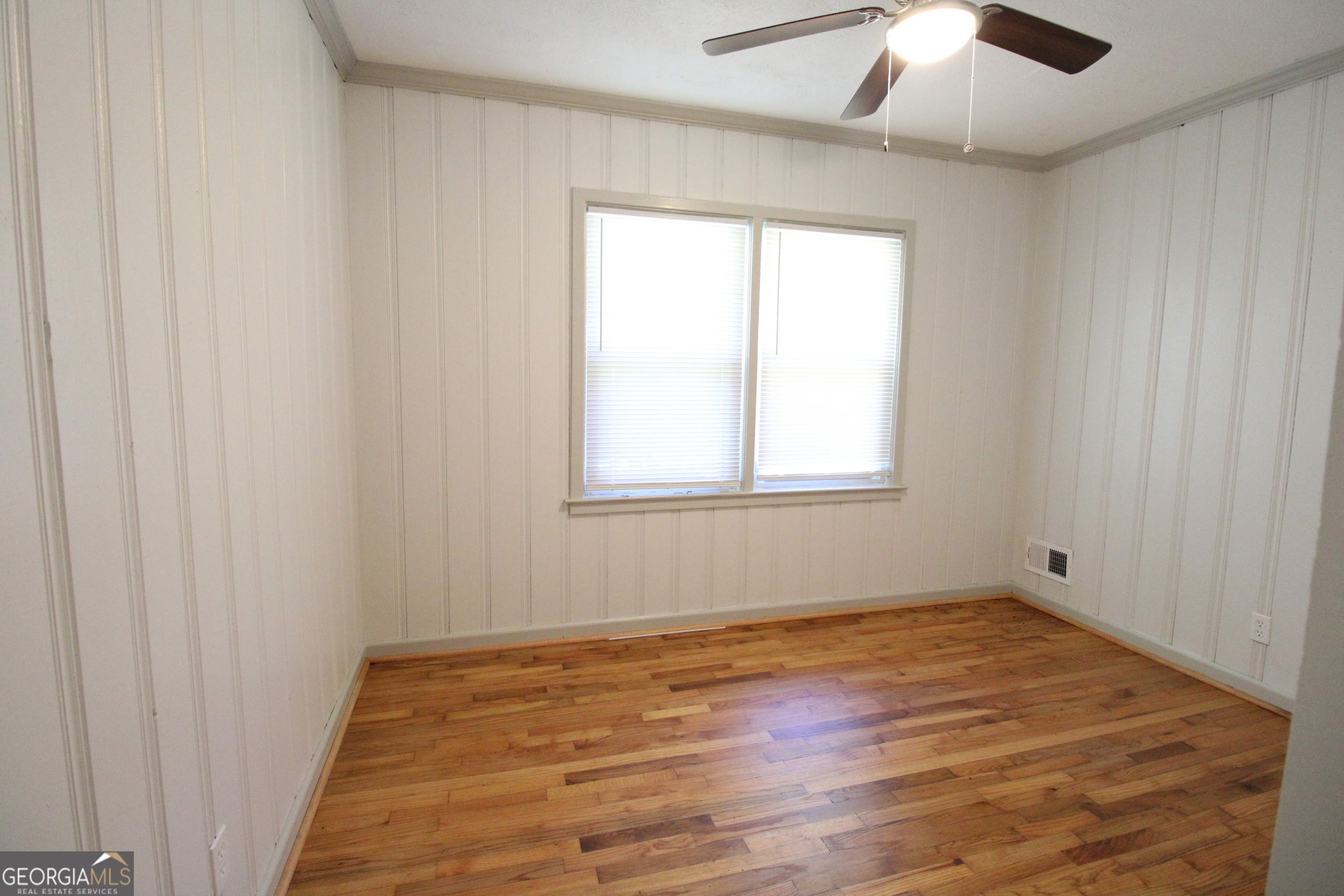 3589 Irwin Way Columbus, GA 31906 - Photo 17 of 25 wooden floor in an empty room with a window
