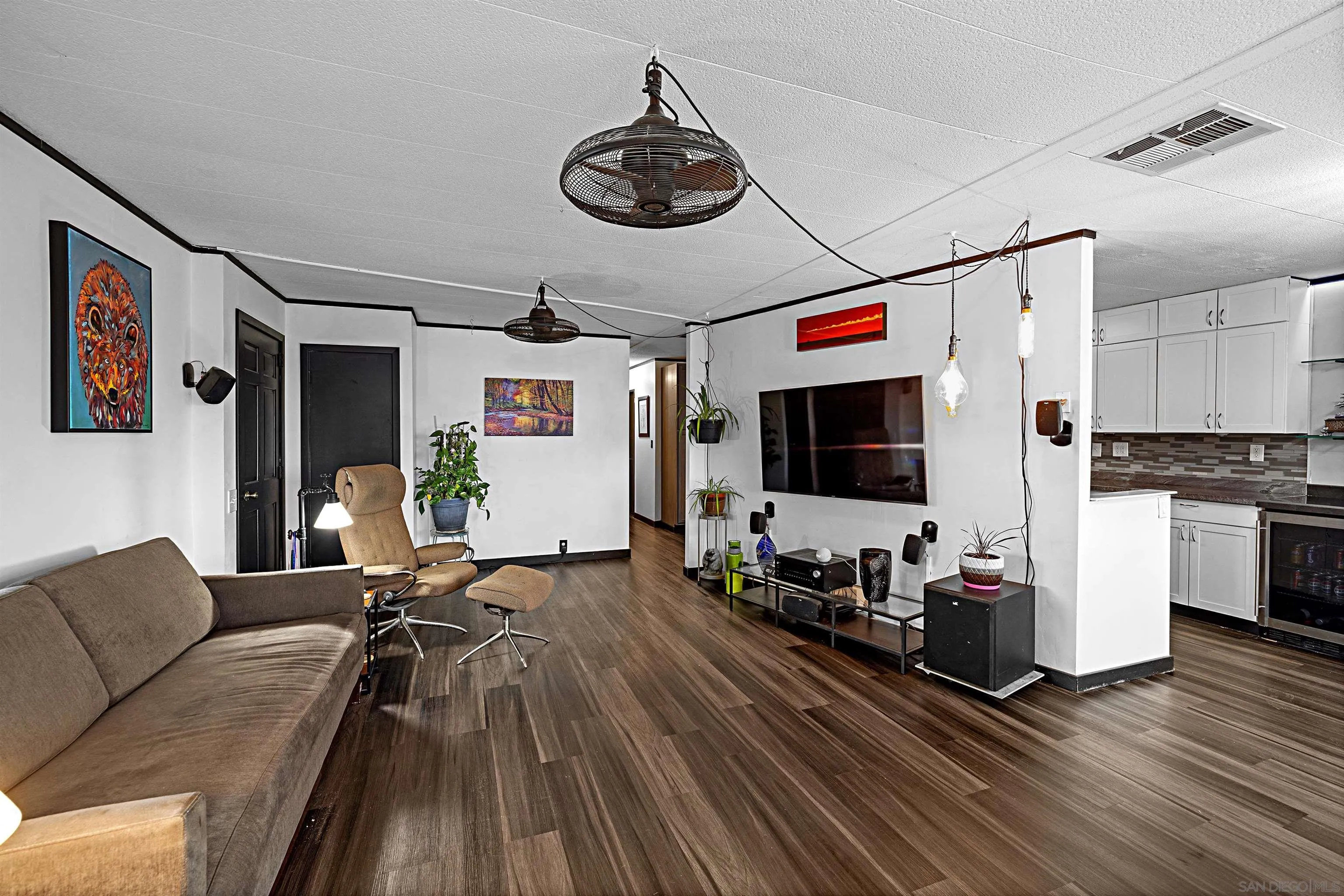 9100 Single Oak Drive, Unit 24 Lakeside, CA 92040 - Photo 11 of 48 a living room with furniture and a flat screen tv