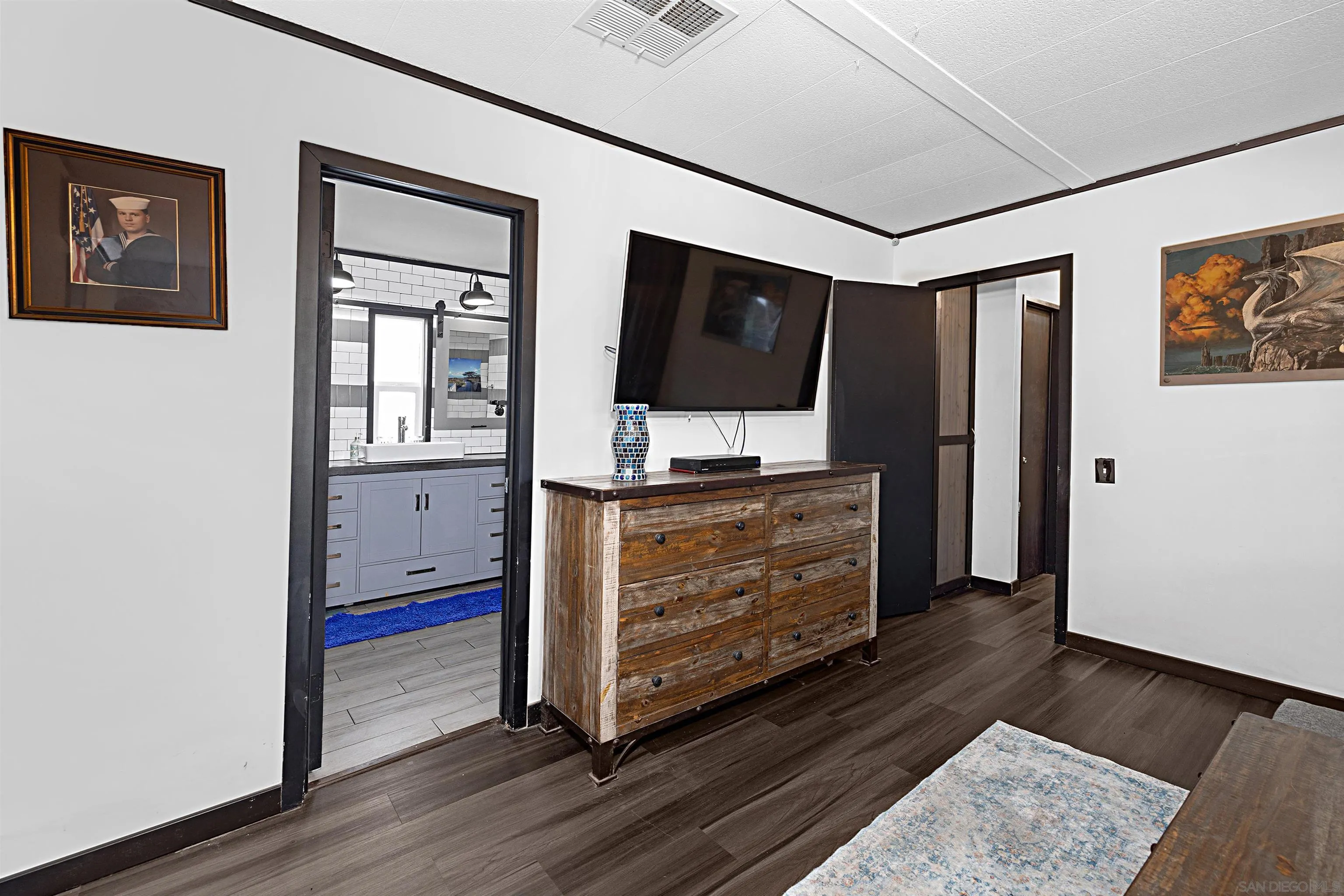 9100 Single Oak Drive, Unit 24 Lakeside, CA 92040 - Photo 17 of 48 a living room with furniture and a flat screen tv