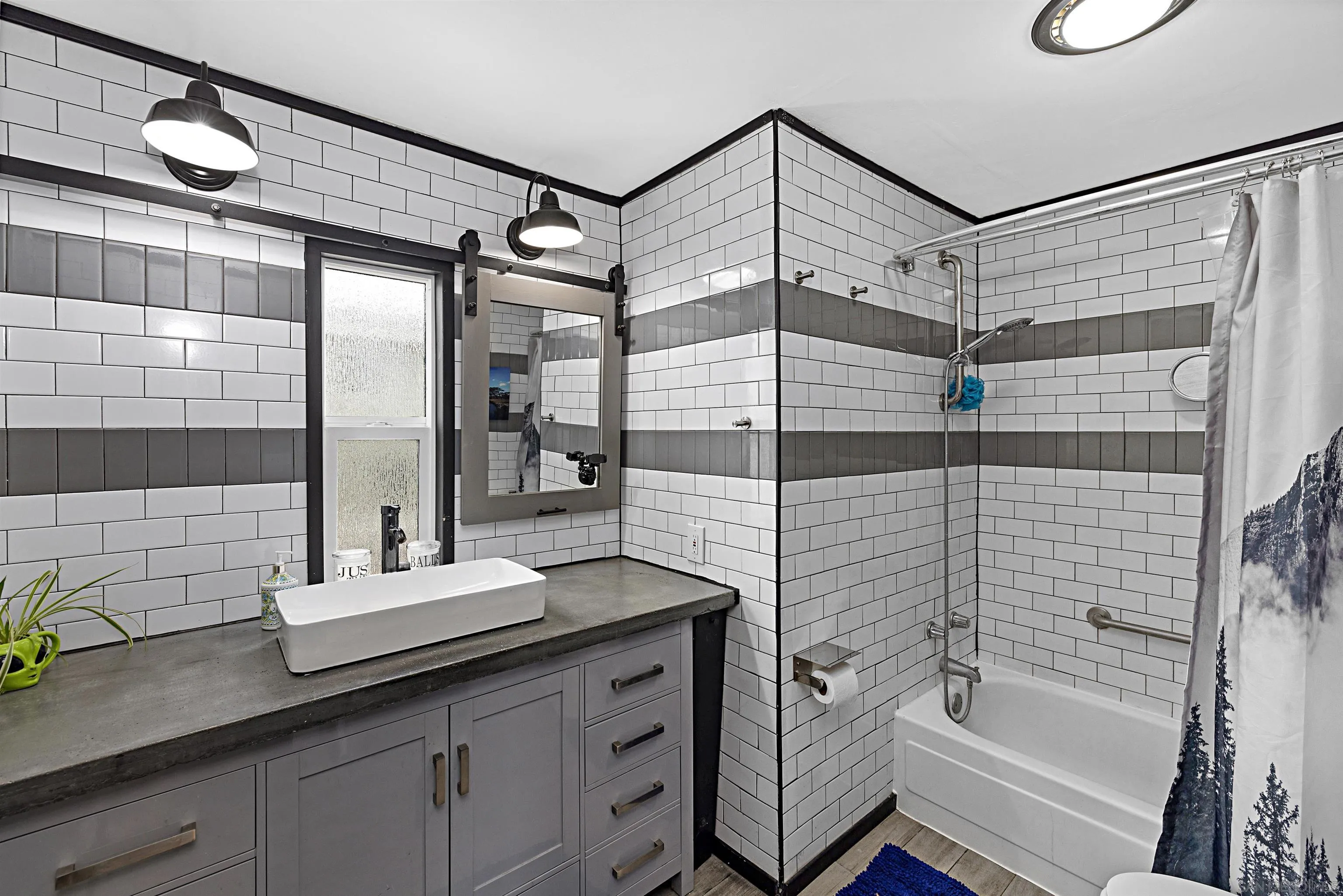 9100 Single Oak Drive, Unit 24 Lakeside, CA 92040 - Photo 18 of 48 a bathroom with a granite countertop sink a mirror a shower and bathtub